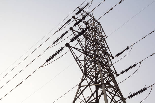 istock electricity tower overhead power line transmission tower on background blue sky. 984177772