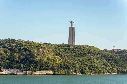 Lisbon, Portugal - May 19, 2017:  The Christ the King (Cristo Rei) monument of Jesus Christ - is a Catholic monument and shrine dedicated to the Sacred Heart of Jesus Christ overlooking the city of Lisbon.