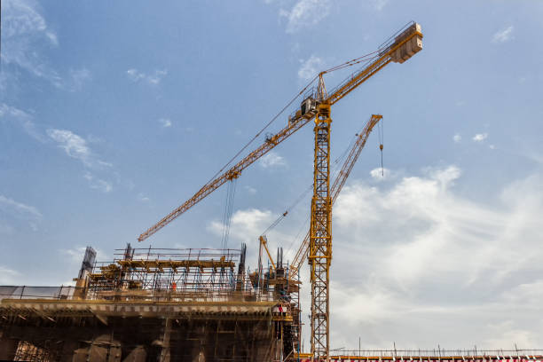 istock Lots of tower Construction site with cranes and building with blue sky background 984187226