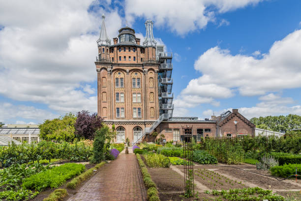 Ancent water tower in Dordrecht, Netherlands Ancient water tower, rebuild and converted into an hotel and  restaurant with a vegetable garden called Villa Augustus in Dordrecht in the Netherlands. dordrecht photos stock pictures, royalty-free photos & images