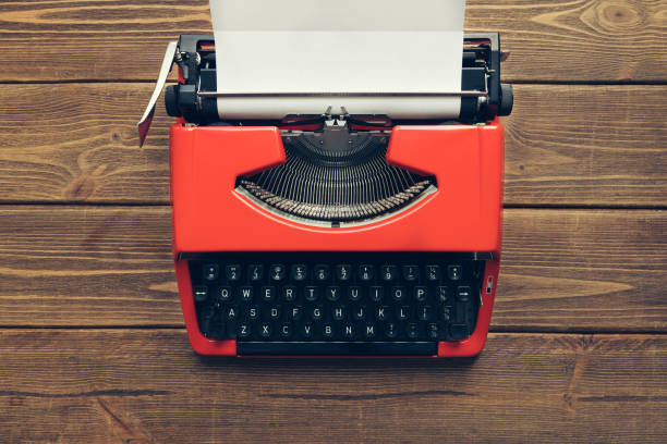istock Vintage typewriter on wooden background 984197934
