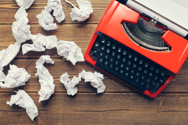 istock Vintage typewriter on wooden background 984198136