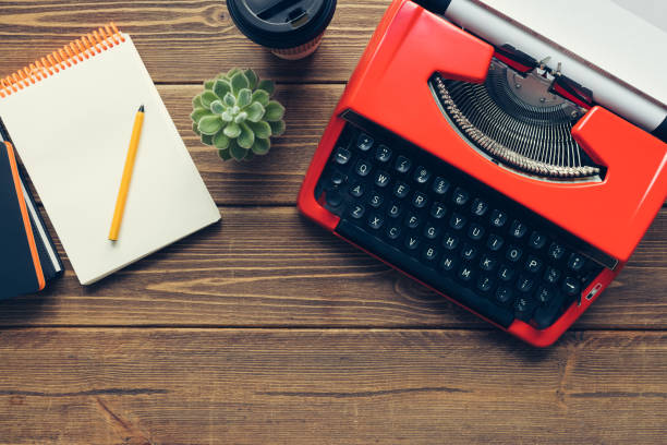 istock Vintage typewriter on wooden background 984198236