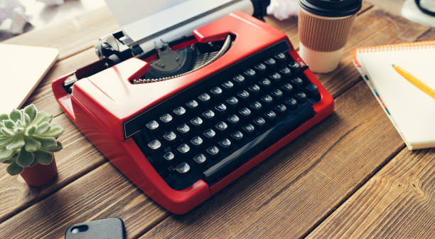 istock Vintage typewriter on wooden background 984198874