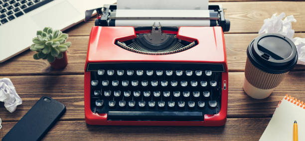 istock Vintage typewriter on wooden background 984199126