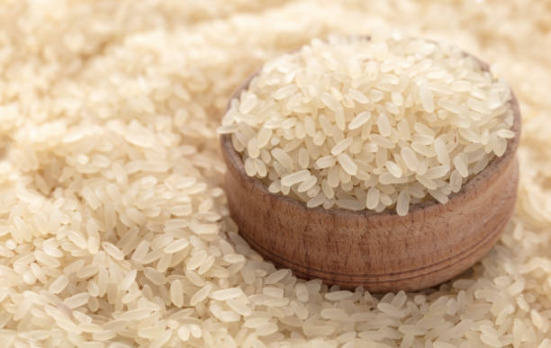 istock background of raw rice closeup 984211488
