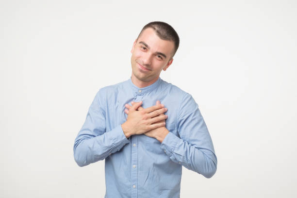 istock Kind spanish man in blue shirt with pleased expression looking into camera 984212218