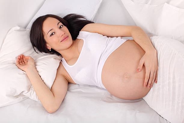 istock Pregnant woman on bed 98422730