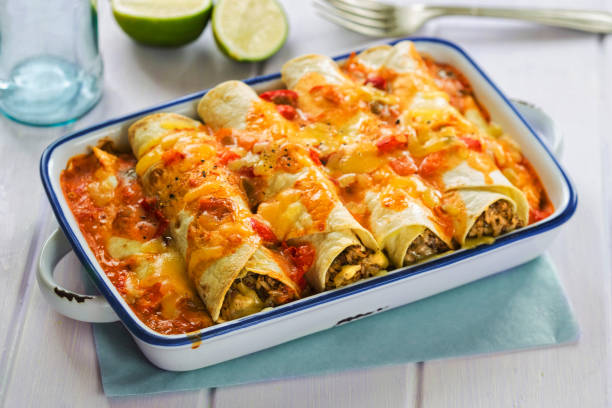 Beef enchiladas with tomato sauce and cheese stock photo