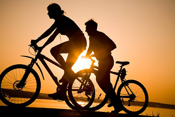 istock sporty couple on bicycles 98423039