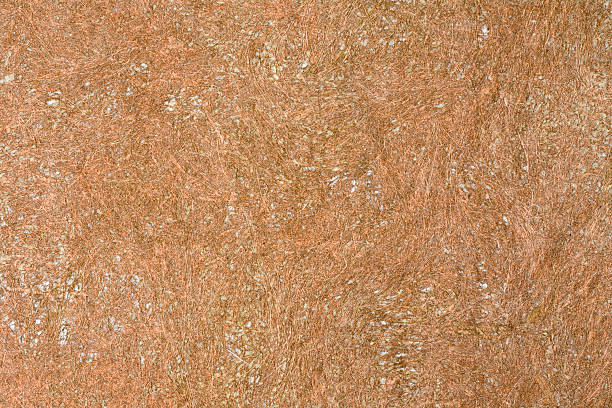 Hand made brown grunge paper with coir fibers stock photo