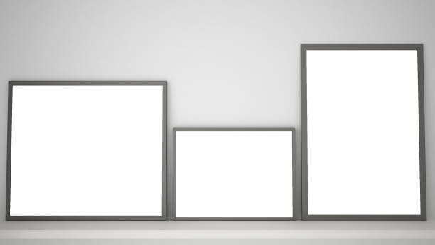 istock Mock up template with copy space, three gray frames on book shelf or desk, white background idea interior design 984253750
