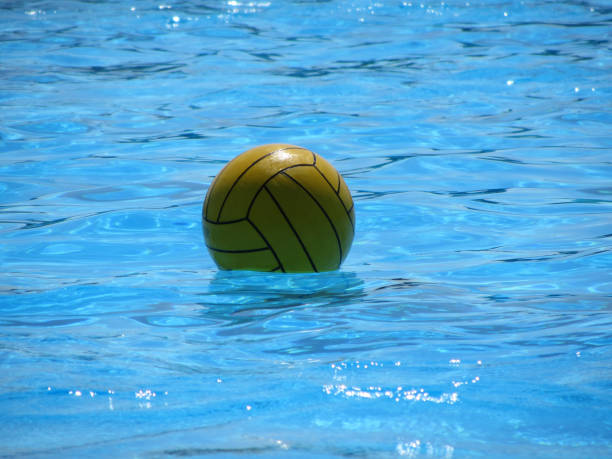 istock Yellow Ball in Swimming Pool 984254060