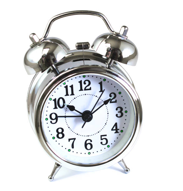 istock Classic retro style alarm clock with bells and hammer isolated against a white background 984258450