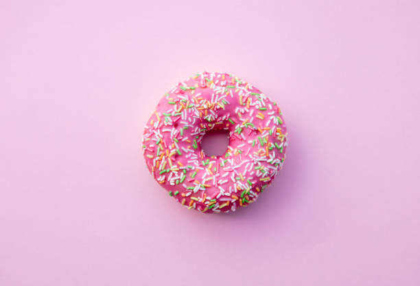 istock Fresh sweet donut on pink background 984262722
