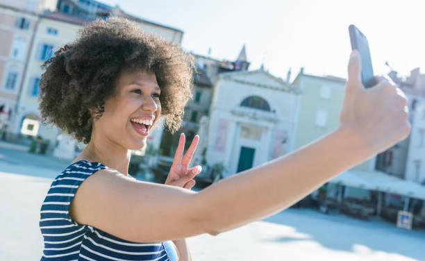 istock Young Woman Is Taking A Selfie With Mobile Phone 984264510