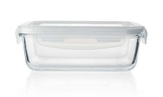 Large empty rounded rectangle clear glass baking dish, isolated on white background, side view.