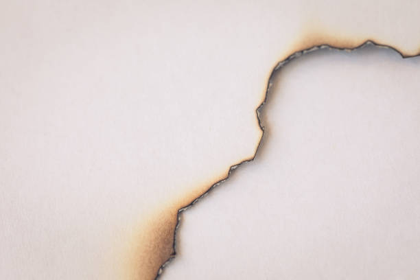 istock Old paper with burnt hole, background concept 984280650