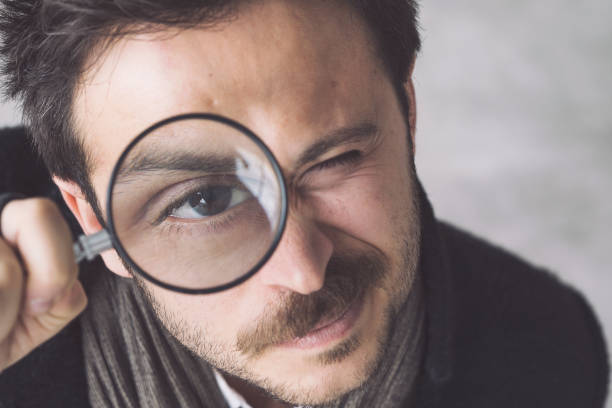 istock Man with the magnifying glass 984284558