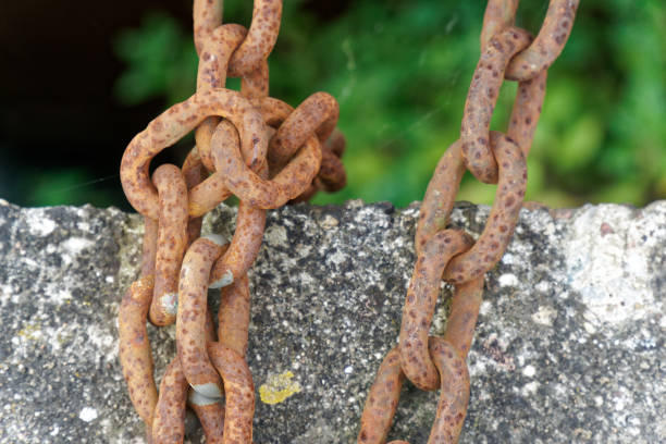 istock Rusty steel chain element, industrial background for commercial use 984284864