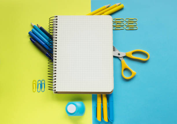 istock Background with notebook and school supplies. Back to school concept View from above 984288756