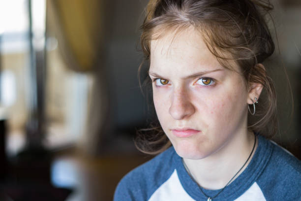 Young girl looking upset and irritated. stock photo