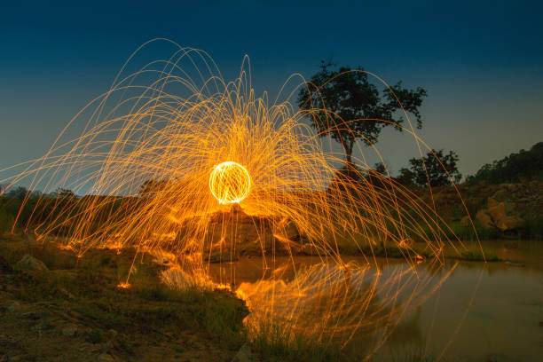 istock burning steel wool on the rock in lagoon 984289338