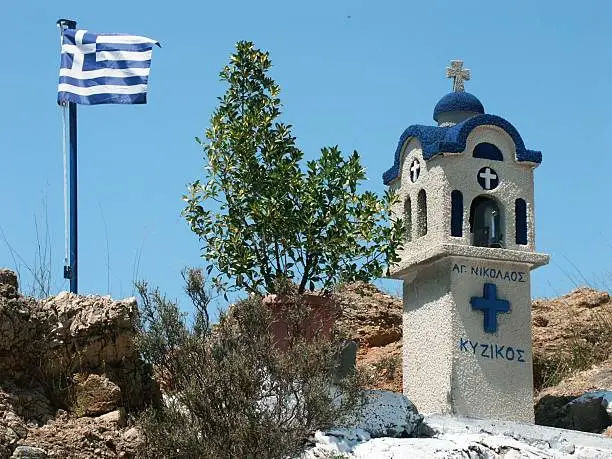 Photo of Greek flag and chapel