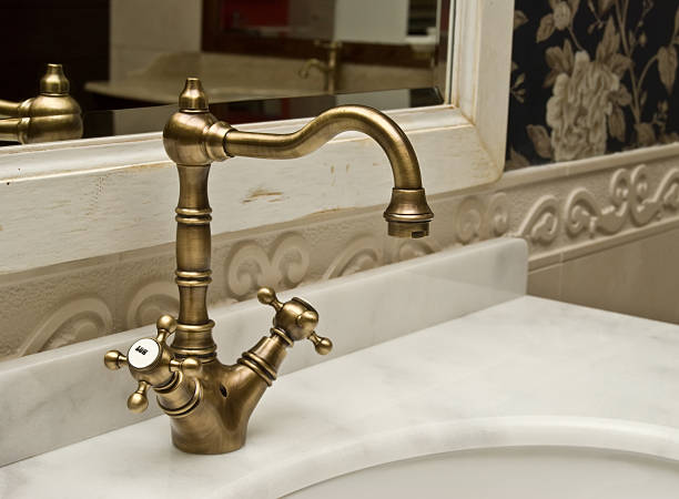 Subject: The hot and cold water spigots of a washbowl sink