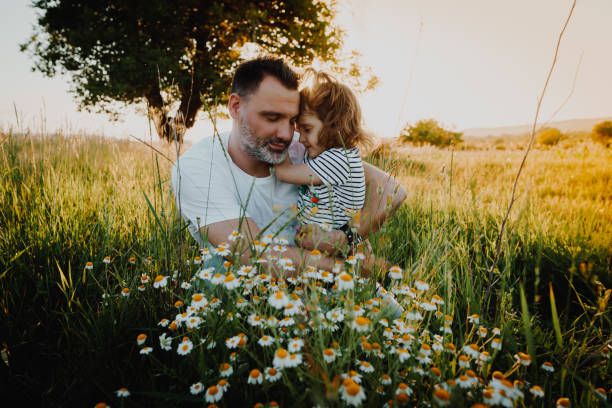 istock Father and daughter playing in wheat field 984312788