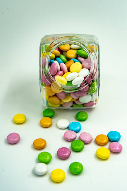 istock Candy jar with chocolates in various colors 984313286