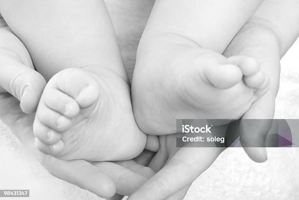 Baby Feet In Mommys Hands Stock Photo - Download Image Now - Baby - Human Age, Body Care, Care