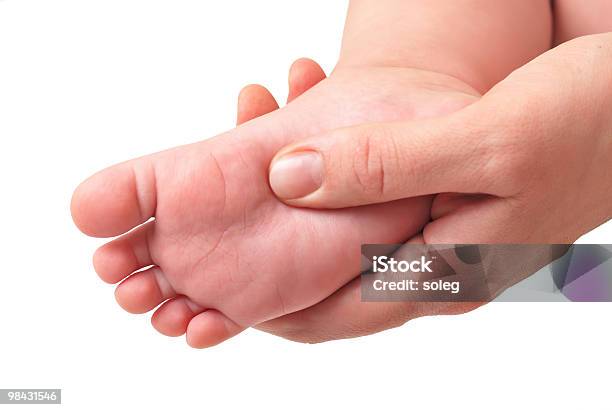 Making Massage Of Childrens Foot Stock Photo - Download Image Now - Baby - Human Age, Body Care, Care