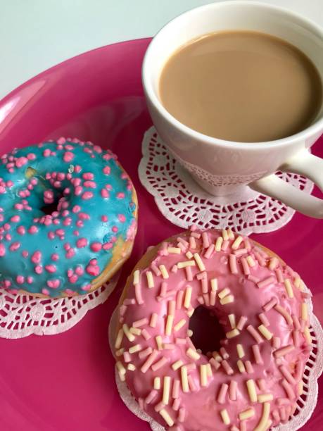 istock Donuts in glaze with sprinkling. 984325196