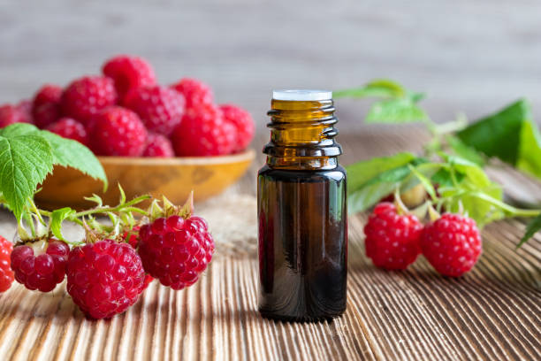 istock A bottle of raspberry seed oil with fresh raspberries 984327564