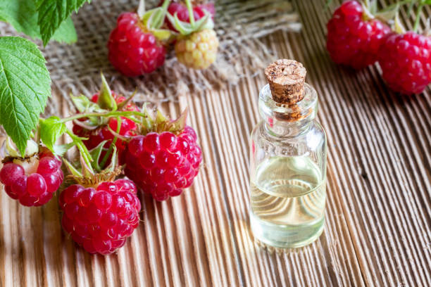 istock A bottle of raspberry seed oil with fresh raspberries 984327582