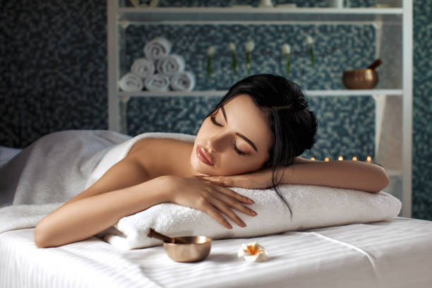 istock beautiful woman in spa salon. 984331244