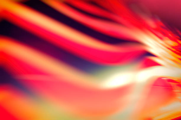 istock Defocused motion blur of spinning red and yellow lights 984343518
