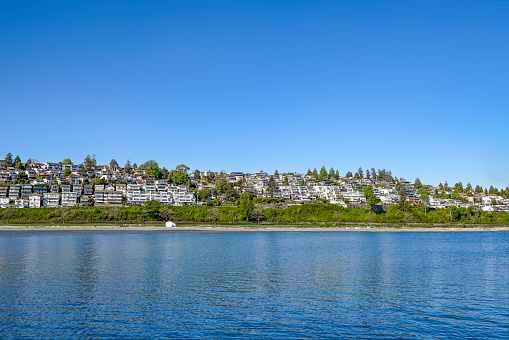 A view of White Rock houses took from across the sea in White Rock City, British Columbia.​