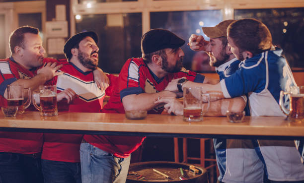 istock Group of men fighting in bar 984369814