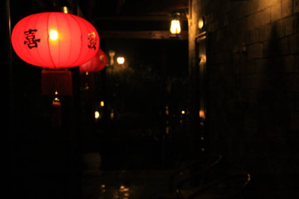 istock red lantern lightened during the night in cosy home 984373400