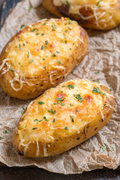 istock Baked loaded potato with bacon, cheese and onion 984397326