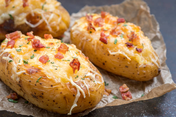 istock Baked loaded potato with bacon, cheese and onion 984397894