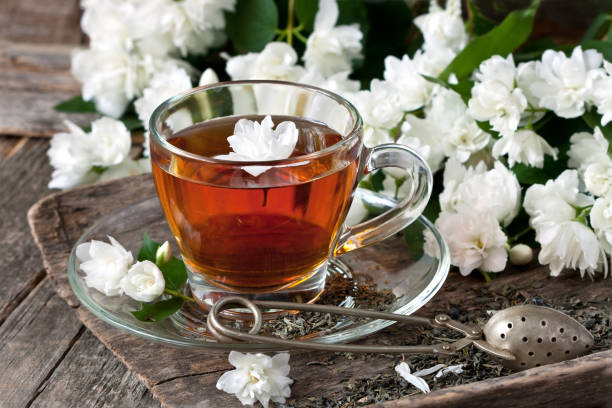 istock Cup of jasmine tea and jasmine flowers 984406060