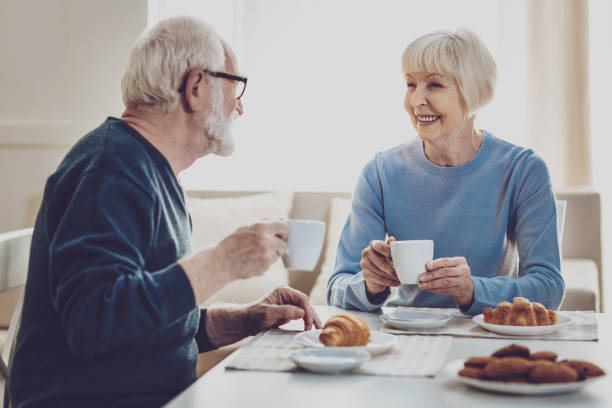 istock Joyful aged people smiling to each other 984413376