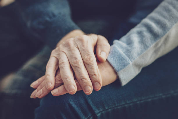 istock Close up of hands being held together 984414526