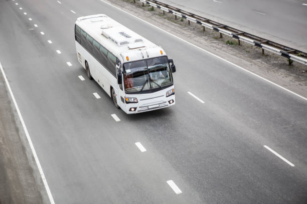 istock bus goes on the highway 984422094