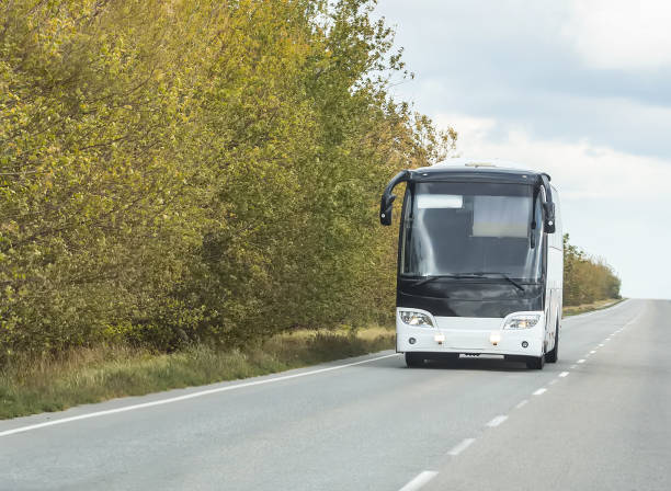 istock tourist bus goes on the highway 984426650
