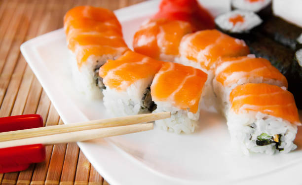istock Roll with Cream Cheese and Cucumber inside. Salmon topped 984427680
