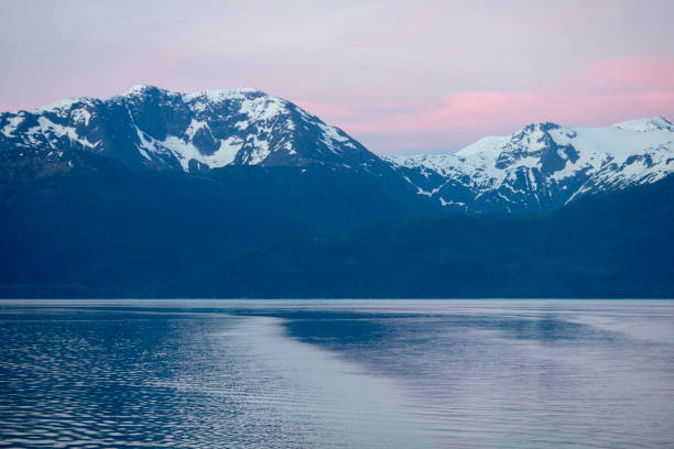 Sunset over mountains and fjord in southeastern Alaska.